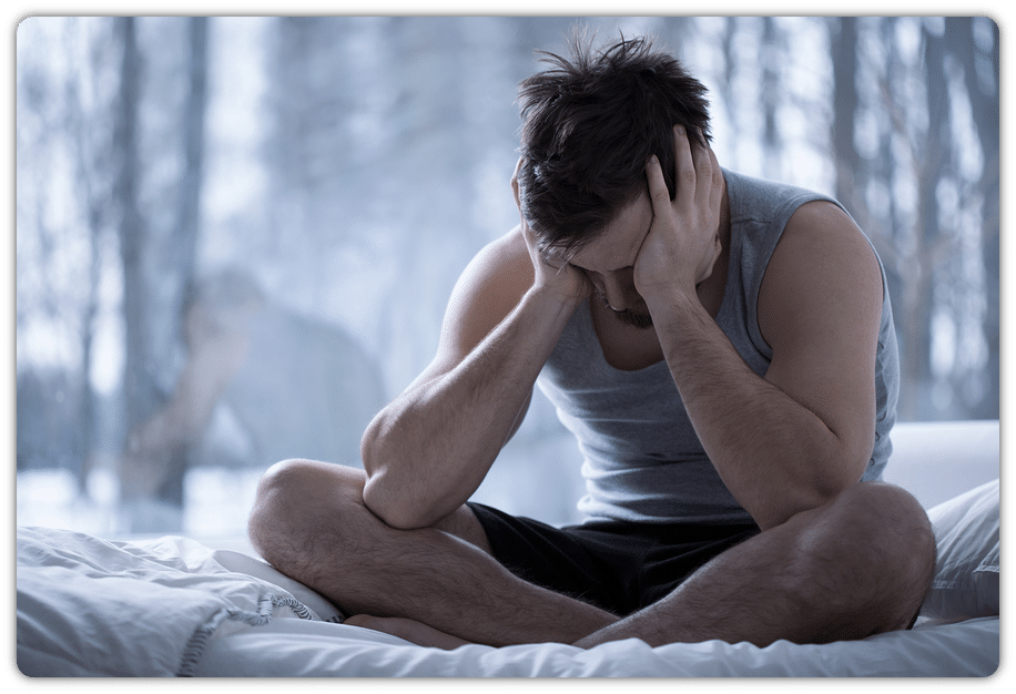 stressed out man with head in hands