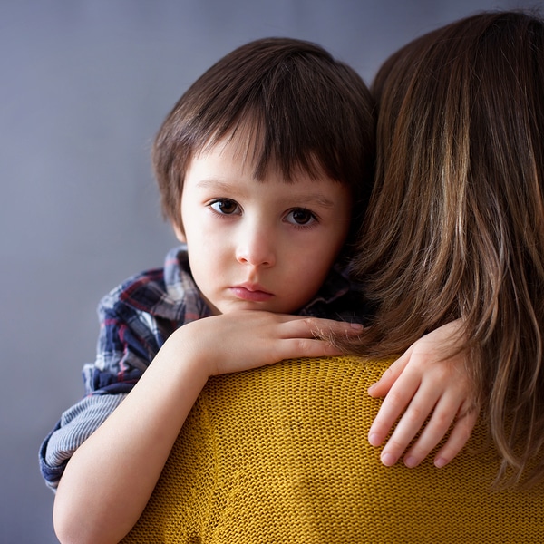 worried-boy-with-mother
