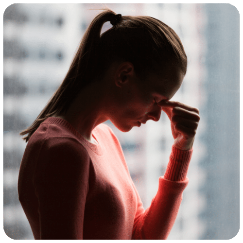 Stressed woman pinching her nose